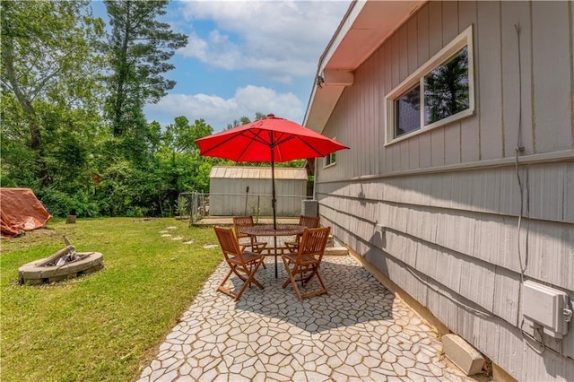 1112 Anderson St, Warrensburg, MO 64093 - view of yard with a fire pit, a patio area, and outdoor dining area