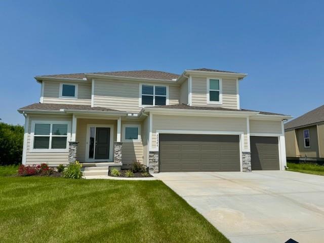 24840 W 178th Ct, Gardner, KS 66030 - prairie-style home featuring concrete driveway, a front lawn, an attached garage, and stone siding