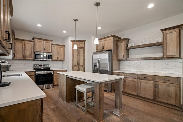 24840 W 178th Ct, Gardner, KS 66030 - kitchen with appliances with stainless steel finishes, open shelves, a center island, decorative backsplash, and dark wood-style flooring