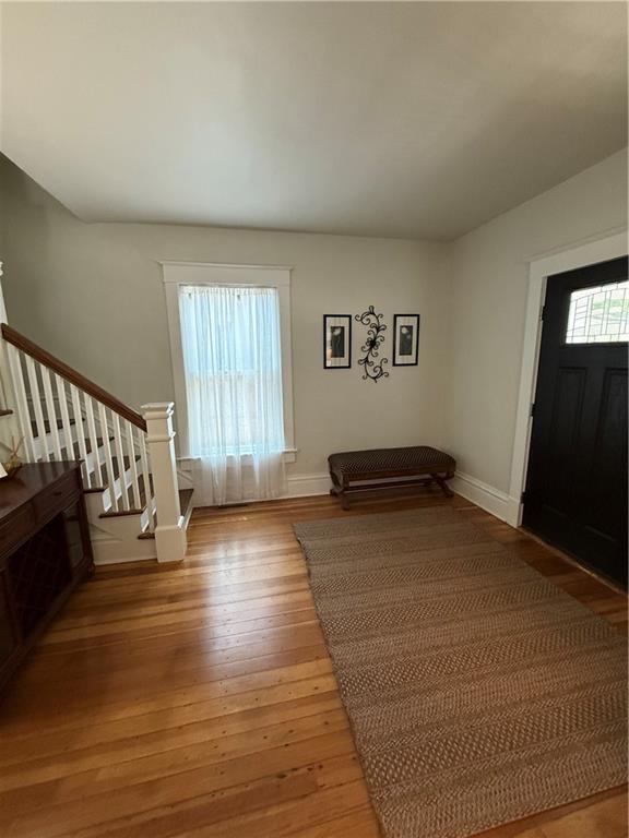 928 S 6th St, Atchison, KS 66002 - entrance foyer with stairs and light wood-type flooring