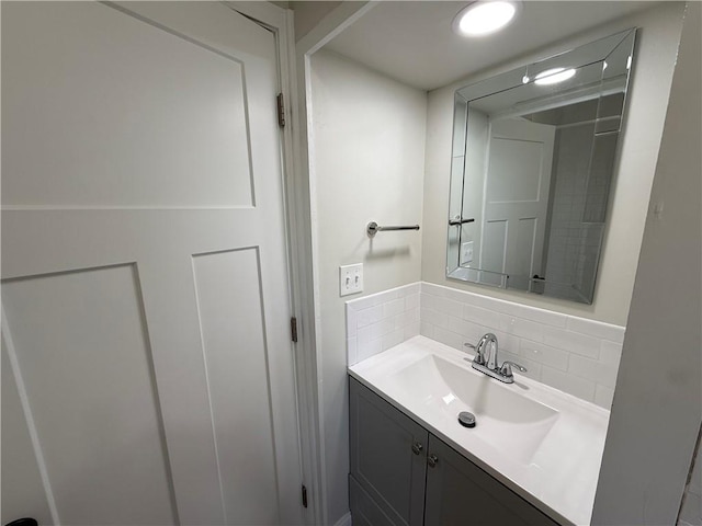928 S 6th St, Atchison, KS 66002 - bathroom with vanity and backsplash