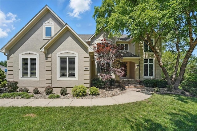 15340 Knox St, Overland Park, KS 66221 - view of front of home with a front lawn and stucco siding