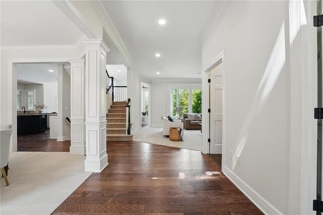 15340 Knox St, Overland Park, KS 66221 - foyer with decorative columns, wood finished floors, stairs, ornamental molding, and recessed lighting