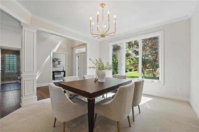 15340 Knox St, Overland Park, KS 66221 - dining space with ornate columns, healthy amount of natural light, a chandelier, and crown molding