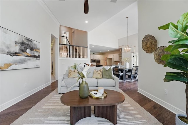 15340 Knox St, Overland Park, KS 66221 - living area featuring a chandelier, dark wood finished floors, ceiling fan, a towering ceiling, and recessed lighting