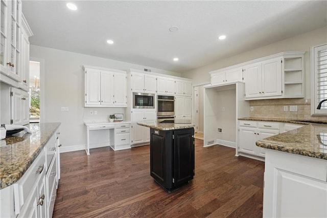 15340 Knox St, Overland Park, KS 66221 - kitchen with appliances with stainless steel finishes, white cabinets, light stone countertops, and recessed lighting
