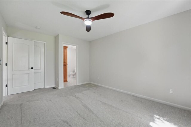15340 Knox St, Overland Park, KS 66221 - unfurnished bedroom with light colored carpet, ensuite bath, and a ceiling fan