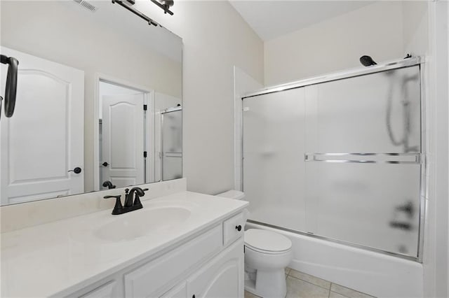 15340 Knox St, Overland Park, KS 66221 - bathroom with vanity, enclosed tub / shower combo, and tile patterned floors