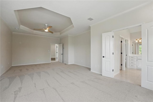 15340 Knox St, Overland Park, KS 66221 - spare room featuring crown molding, carpet flooring, a ceiling fan, and a raised ceiling