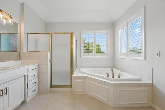 15340 Knox St, Overland Park, KS 66221 - bathroom with vanity, a garden tub, a stall shower, and tile patterned floors