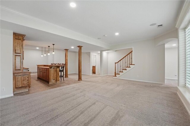 15340 Knox St, Overland Park, KS 66221 - unfurnished living room featuring a bar, stairs, crown molding, recessed lighting, and light carpet