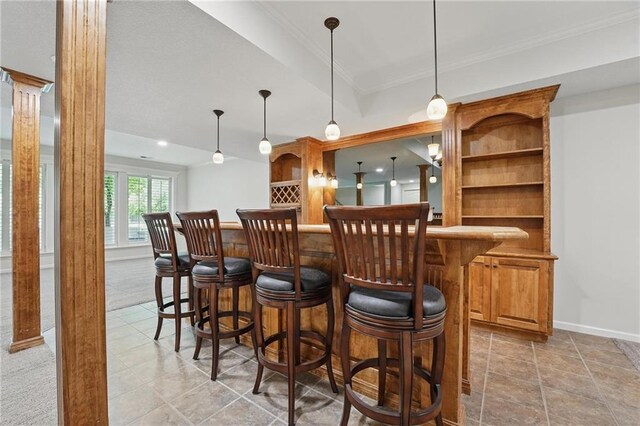 15340 Knox St, Overland Park, KS 66221 - indoor dry bar featuring crown molding, ornate columns, and pendant lighting