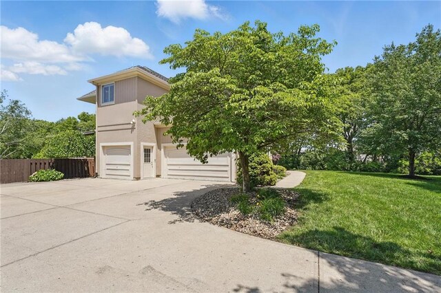 15340 Knox St, Overland Park, KS 66221 - view of home's exterior with a garage and driveway
