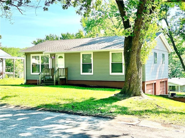 2401 Ivy Ct, Saint Joseph, MO 64503 - view of front of house with a front lawn and a shingled roof