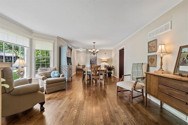 3514 W 47th Pl, Roeland Park, KS 66205 - living room with ornamental molding, a chandelier, and dark wood-style floors