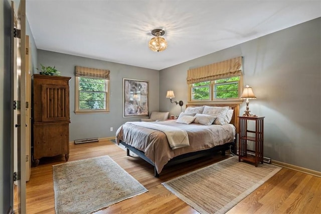 3514 W 47th Pl, Roeland Park, KS 66205 - bedroom featuring baseboards and light wood-style flooring