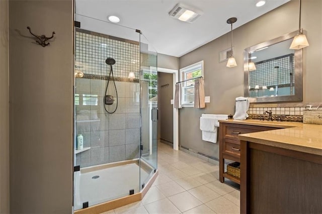 3514 W 47th Pl, Roeland Park, KS 66205 - full bathroom featuring vanity, a shower stall, backsplash, tile patterned flooring, and recessed lighting