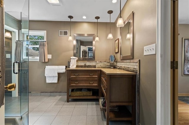 3514 W 47th Pl, Roeland Park, KS 66205 - bathroom featuring vanity, backsplash, a stall shower, tile patterned floors, and recessed lighting