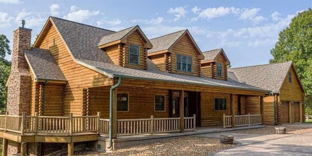30611 Stonehaven Dr, Warsaw, MO 65355 - cabin with a porch, a chimney, log siding, and roof with shingles