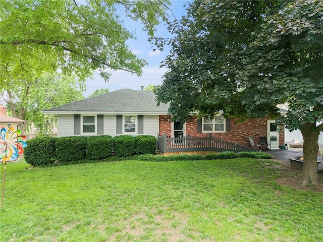308 E Meadow St, Smithville, MO 64089 - view of front of home featuring a front yard and brick siding