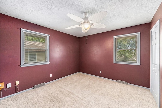 308 E Meadow St, Smithville, MO 64089 - carpeted spare room with ceiling fan and a textured ceiling