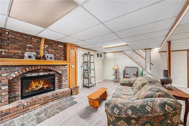 308 E Meadow St, Smithville, MO 64089 - living area with a paneled ceiling, a brick fireplace, and carpet floors
