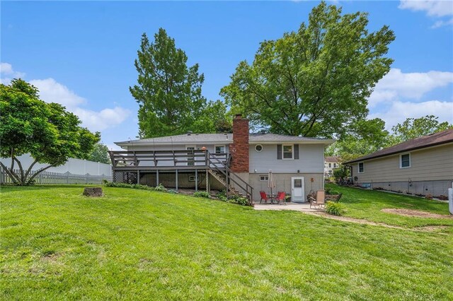 308 E Meadow St, Smithville, MO 64089 - back of house with stairs, a patio area, a deck, and a chimney