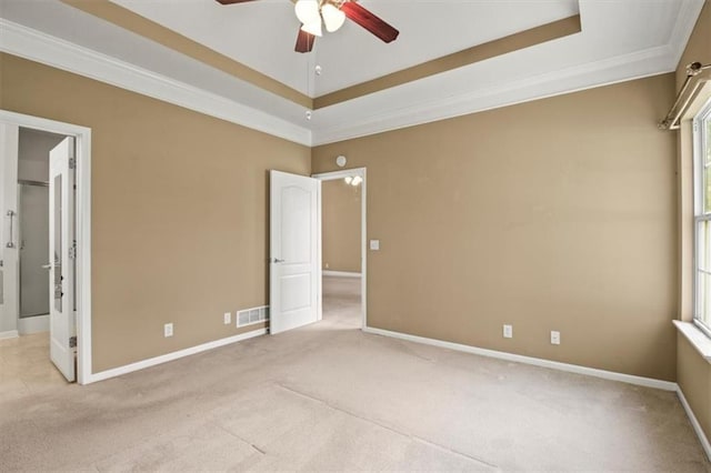 1111 SW 13th St, Oak Grove, MO 64075 - unfurnished bedroom featuring light colored carpet, a raised ceiling, crown molding, and ceiling fan