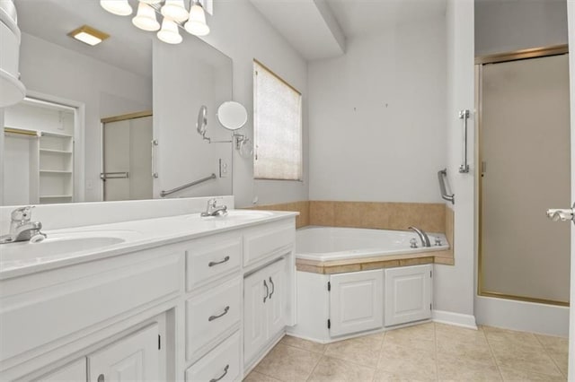 1111 SW 13th St, Oak Grove, MO 64075 - bathroom with a shower stall, a garden tub, double vanity, and tile patterned floors