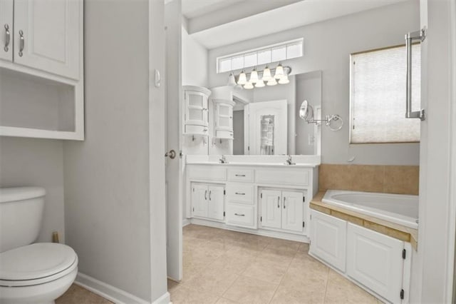1111 SW 13th St, Oak Grove, MO 64075 - bathroom with double vanity, a garden tub, and tile patterned flooring