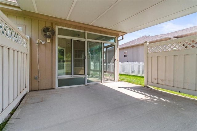 1111 SW 13th St, Oak Grove, MO 64075 - view of patio featuring a sunroom