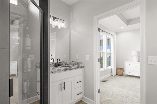 1104 SW Magnolia Cir, Oak Grove, MO 64075 - bathroom featuring vanity, a shower stall, and crown molding