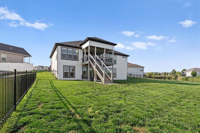 1104 SW Magnolia Cir, Oak Grove, MO 64075 - rear view of house with stairs and a fenced backyard