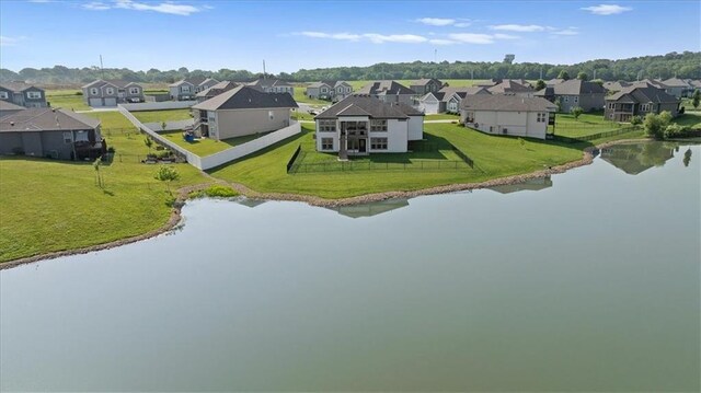 1104 SW Magnolia Cir, Oak Grove, MO 64075 - aerial perspective of suburban area with a large body of water