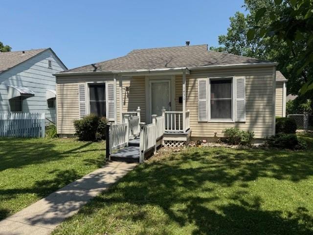 1436 E 23rd Ave, North Kansas City, MO 64116 - bungalow-style house featuring roof with shingles