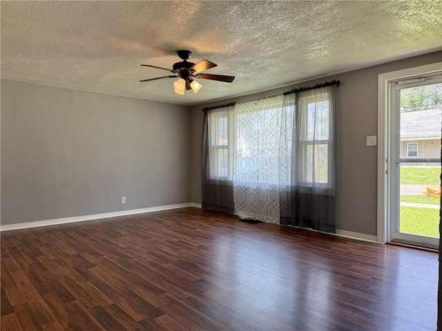 1514 Bryan St, Chillicothe, MO 64601 - unfurnished room featuring dark wood-style floors, a textured ceiling, and ceiling fan