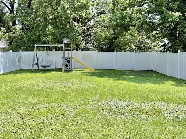1514 Bryan St, Chillicothe, MO 64601 - fenced backyard with a playground