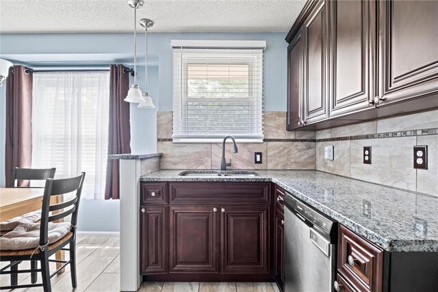 5011 Briar St, Roeland Park, KS 66205 - kitchen with stainless steel dishwasher, dark brown cabinets, light stone countertops, decorative light fixtures, and a textured ceiling
