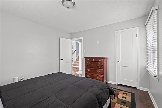 5011 Briar St, Roeland Park, KS 66205 - bedroom featuring wood finished floors and a textured ceiling