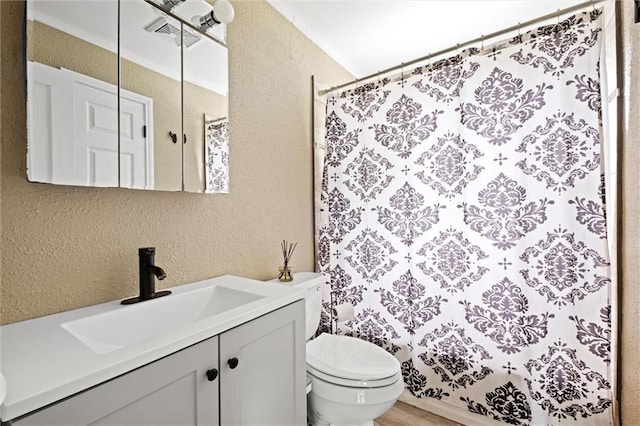 5011 Briar St, Roeland Park, KS 66205 - bathroom with a textured wall, vanity, and curtained shower