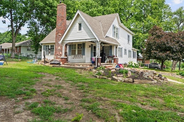 402 Fifth St, Smithville, MO 64089 - view of front of home featuring a chimney, a porch, and roof with shingles