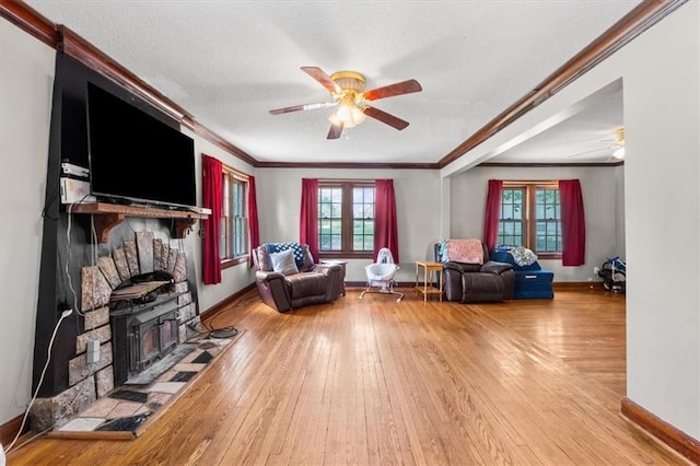 402 Fifth St, Smithville, MO 64089 - living room featuring ornamental molding, a ceiling fan, hardwood / wood-style floors, and a textured ceiling