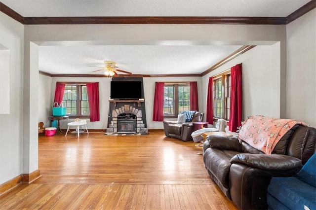 402 Fifth St, Smithville, MO 64089 - living room with ornamental molding, light wood finished floors, and a ceiling fan