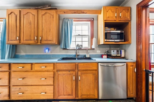 402 Fifth St, Smithville, MO 64089 - kitchen featuring stainless steel appliances, light countertops, brown cabinetry, and crown molding