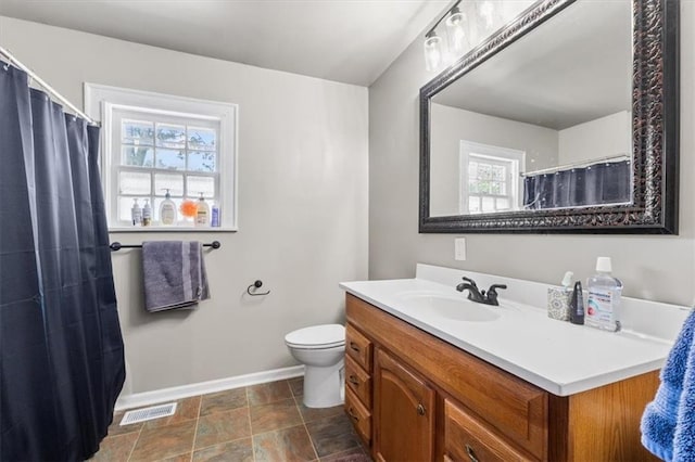 402 Fifth St, Smithville, MO 64089 - full bath featuring vanity, stone finish flooring, and curtained shower