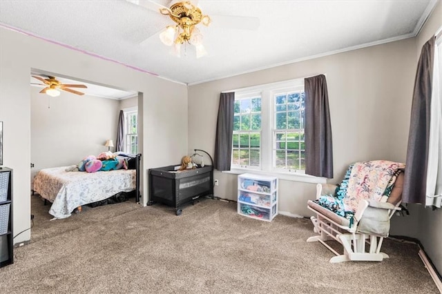 402 Fifth St, Smithville, MO 64089 - carpeted bedroom featuring multiple windows, ornamental molding, and ceiling fan