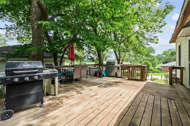 402 Fifth St, Smithville, MO 64089 - deck featuring area for grilling and outdoor dining space