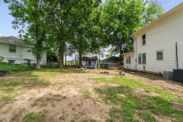 402 Fifth St, Smithville, MO 64089 - view of yard with a trampoline