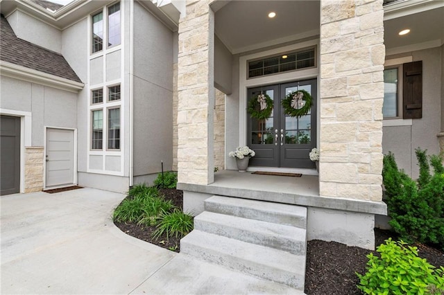 11807 S Kenton St, Olathe, KS 66061 - entrance to property with french doors, stone siding, and stucco siding