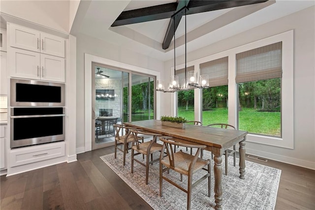 11807 S Kenton St, Olathe, KS 66061 - dining area featuring a chandelier, plenty of natural light, dark wood-style floors, and a raised ceiling